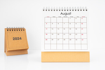 Monthly desk calendar August 2024 year on white table