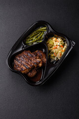 Fresh juicy delicious beef steak on a dark background