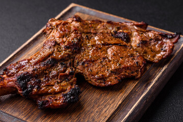 Juicy beef tomahawk steak on the bone baked on the grill