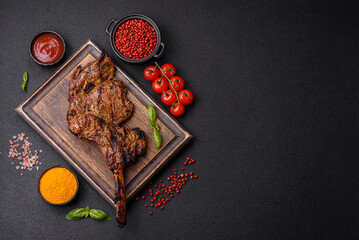 Juicy beef tomahawk steak on the bone baked on the grill