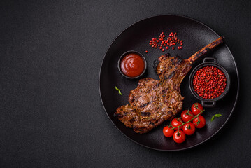 Juicy beef tomahawk steak on the bone baked on the grill