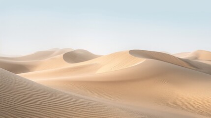 Rolling dunes under a clear sky