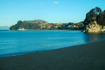 Strolling on the beach under the winter sun in New Zealand