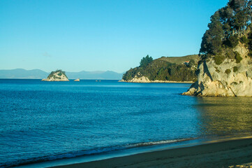 Strolling on the beach under the winter sun in New Zealand