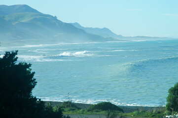 Strolling on the beach under the winter sun in New Zealand