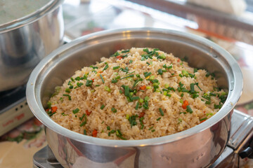 Chinese-style stir-fried rice with egg, vegetables, and pork