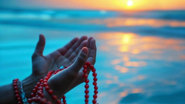 Muslim Man Praying at Sunset. Hands Holding Prayer Beads (Misbaha) in Devotion on a Tranquil Beach. Islam, Faith, Spirituality Concept. Seeking Blessings at Sunset