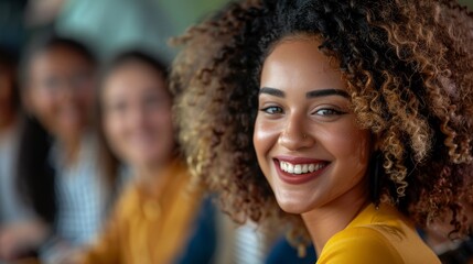 Fototapeta premium Happy multi-ethnic business people sit together in the office, laughing and smiling while listening to a close-up portrait of a lecture or training session