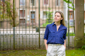 Smiling Woman in Blue Shirt Outdoors