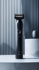 A modern black electric shaver on a white surface with shadows, representing advanced grooming technology and a stylish addition to personal care routines.