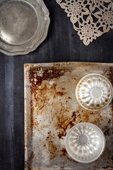 Various old kitchen objects on black chalkboard background