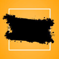 Abstract black brush stroke and splatter on yellow background with white frame, concept of artistic...