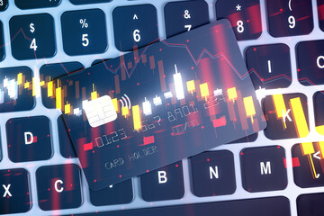 A creative double exposure concept with hologram of financial graphs over a computer keyboard, blending technology and business