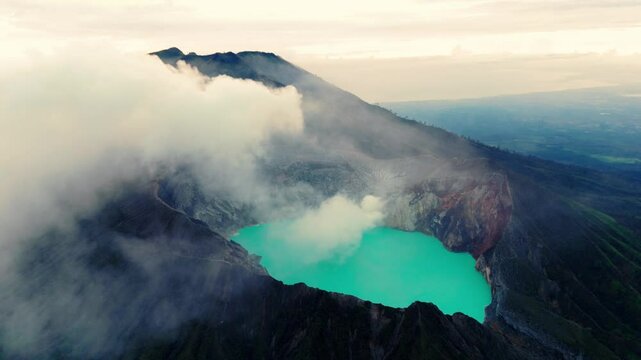 Aerial Footage of Kawah Ijen Crater at Sunrise with Mist and Turquoise 