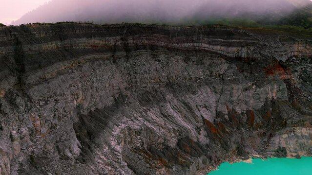 Aerial Sunrise Footage of Kawah Ijen Crater with Turquoise Lake and Mist