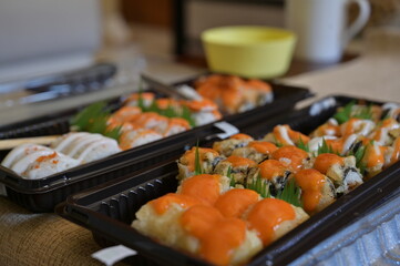 Various of Japanese food close up view. Served asian sushi rolls close up macro shot. Japanese seafood restaurant. Fresh salmon fish with rice. Traditional Japan food.