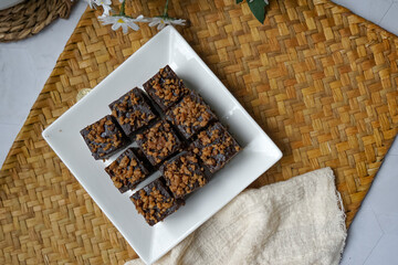Kuih kole kacang, a steamed Malaysian cake, made with fried green bean flour, coconut milk, and...