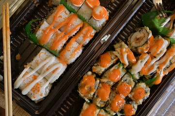 Various of Japanese food top down view. Served asian sushi rolls close up macro shot. Japanese seafood restaurant. Flat lay format.