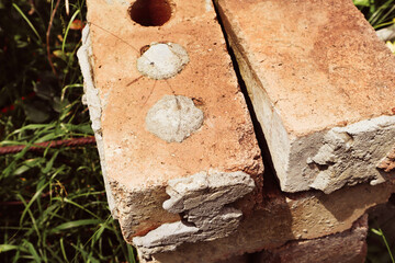 Red bricks are old. Construction material.	