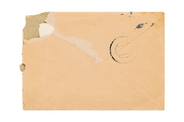 Old torn brown envelope with stamp isolated