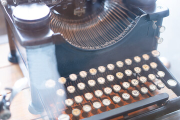 vintage typewriter ,old typewriter on bokeh light background