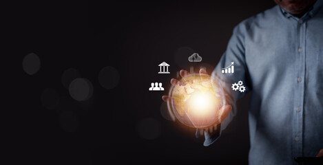 A marketing manager is holding a glowing globe with various icons on it. Concept of a global network or interconnectedness, with the globe representing the world