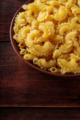 Uncooked Creste di Gallo Pasta in Bowl, Copy Space