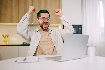 excited young man remote worker get email reward for performance of professional skills recognition...