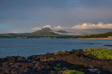 Nice beach in the day. Lava rocks alternate with white fine sandy beach. Coastal landscape of an...