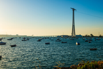 Fishing boats lie at anchor at sunrise in the bay of Cadiz in Spain