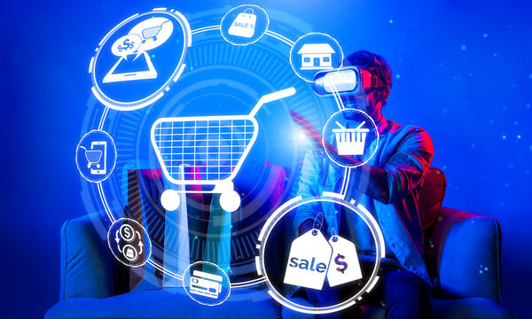 Happy man using VR headset and shopping online while sitting at sofa with shopping bags. Smart person looking at online market hologram and icon with neon background. Innovation technology. Deviation.