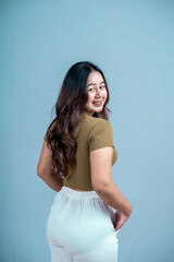 Photo of active Asian girl isolated blue color background