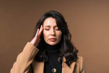 Mature woman is suffered, headache. Migraine, massages temples, magnetic storms