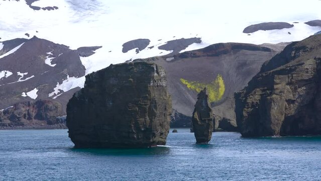 Antarctica Remote Sea Stacks Islands Rocks Boulders Mountains Sailing by Snow Covered Land Ocean Deception Bay
