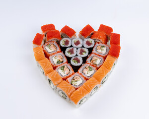Heart shaped set of sushi rolls for Valentine's Day. Menu or delivery concept, Top view