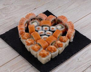 Heart shaped set of sushi rolls for Valentine's Day. Menu or delivery concept, Top view