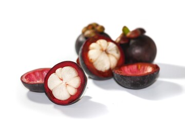Pictures of mangosteen put on the white background with isolation concept.