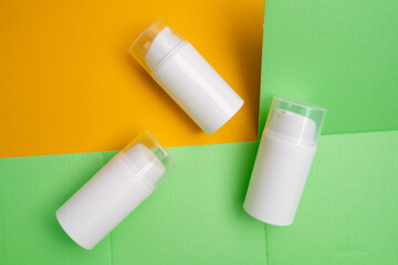 Container for cream, shampoo, toiletries, spa. Unbranded white plastic bottles. Bottle with a dispenser for cosmetic products. Skin care and beauty concept. Mockup style, copy space 