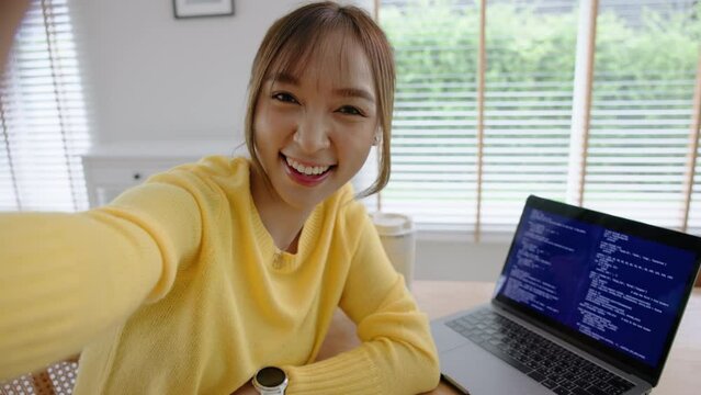 POV Young adult asia Gen z girl relax smile face WFH look at camera take photo shoot snap shot show share using snapchat app send post viral video vlog IG reels story instagram. Fun joy work at home.