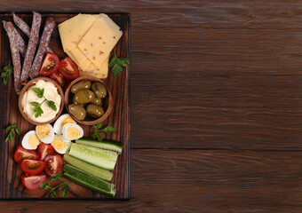 antipasti board with cheese, olives and fresh vegetables