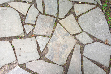 Background of pieces of stone tiles of the path.