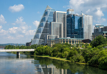 Fototapeta premium Modern apartment buildings and offices by the Colorado River in cityscape skyline of Austin Texas