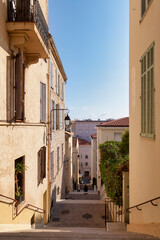 Narrow street in the hill of the district of Le Suquet in Cannes