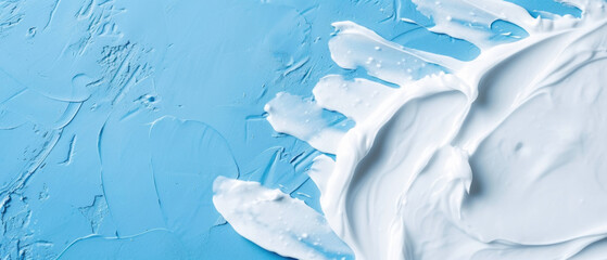 Close up of White Toothpaste on a Solid Rough Blue Background with Empty Copy Space for Text. Macro Top View of Dental Care Concept Advertisement Commercial Banner, Teeth Hygiene Advertising Cover