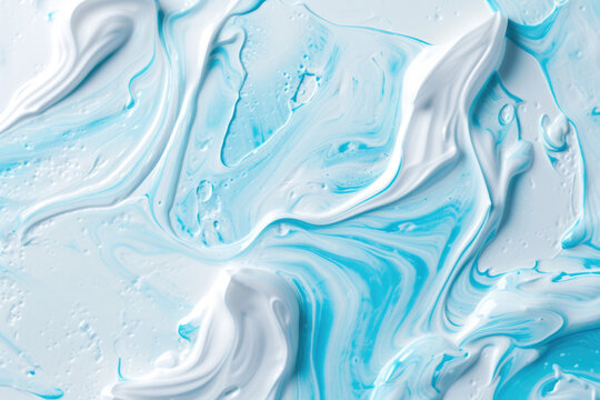 Close up of Toothpaste Texture: Top View of White and Blue Toothpaste  on Solid Surface Background. Stomatology and Dental Care Textured Product Backdrop