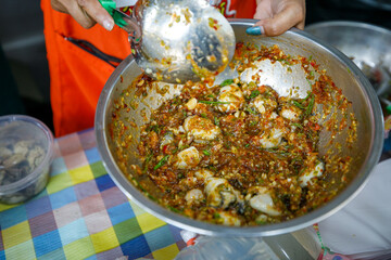 Fresh Oysters salad saver with fried onions and acacia. Thai style seafood. Thailand local restaurant.