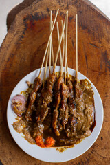 Freshly cooked chicken satay served with special peanut sauce mixed with soy sauce and pickled red onions