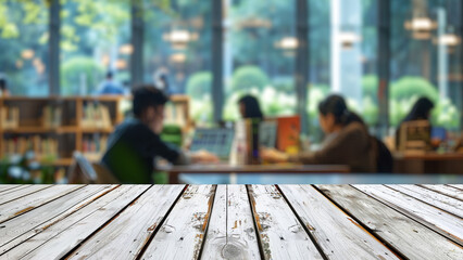Empty wood table top with blur background of library at school or university. The table giving copy space for placing advertising product on the table along with beautiful library book background.
