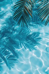 Shadows of palm leaves reflected in the calm water of a swimming pool