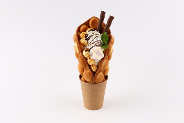 Hong kong or bubble waffle with ice cream and fruits isolated on white background
